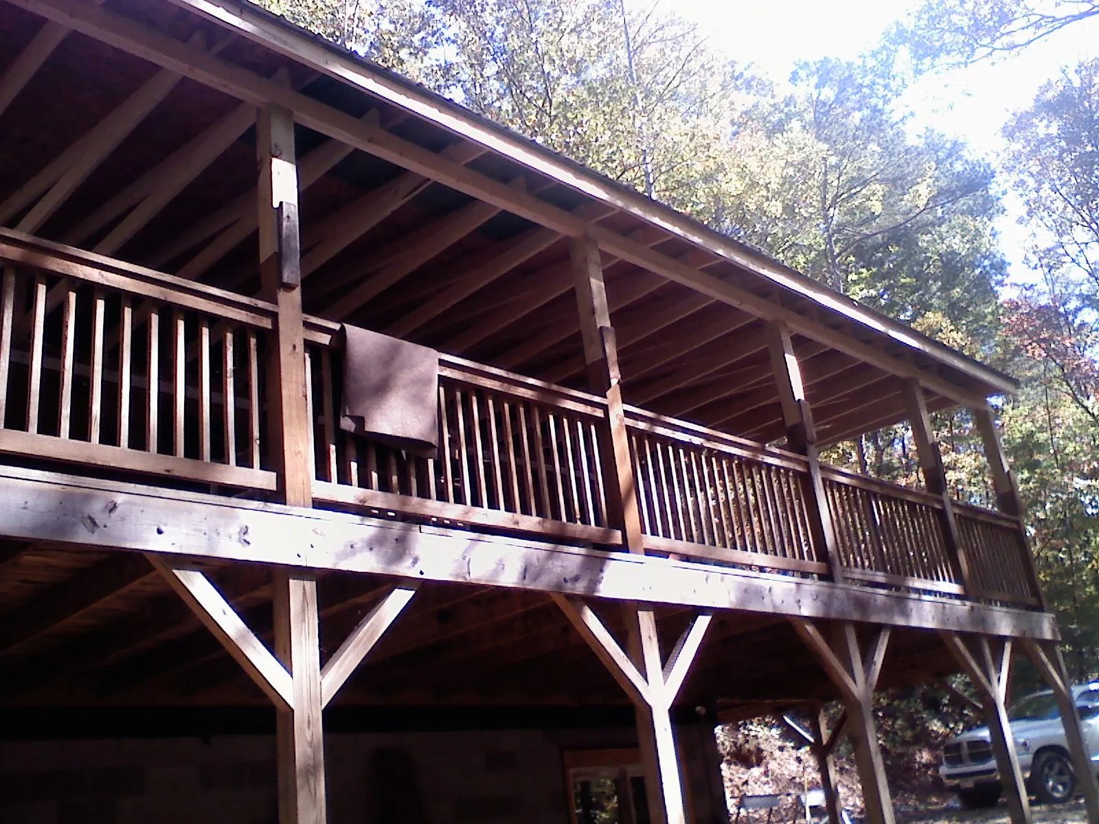 Timber framing under a new elevated porch and deck — Roof Leak Repair in Big Rapids by Roofing Brothers